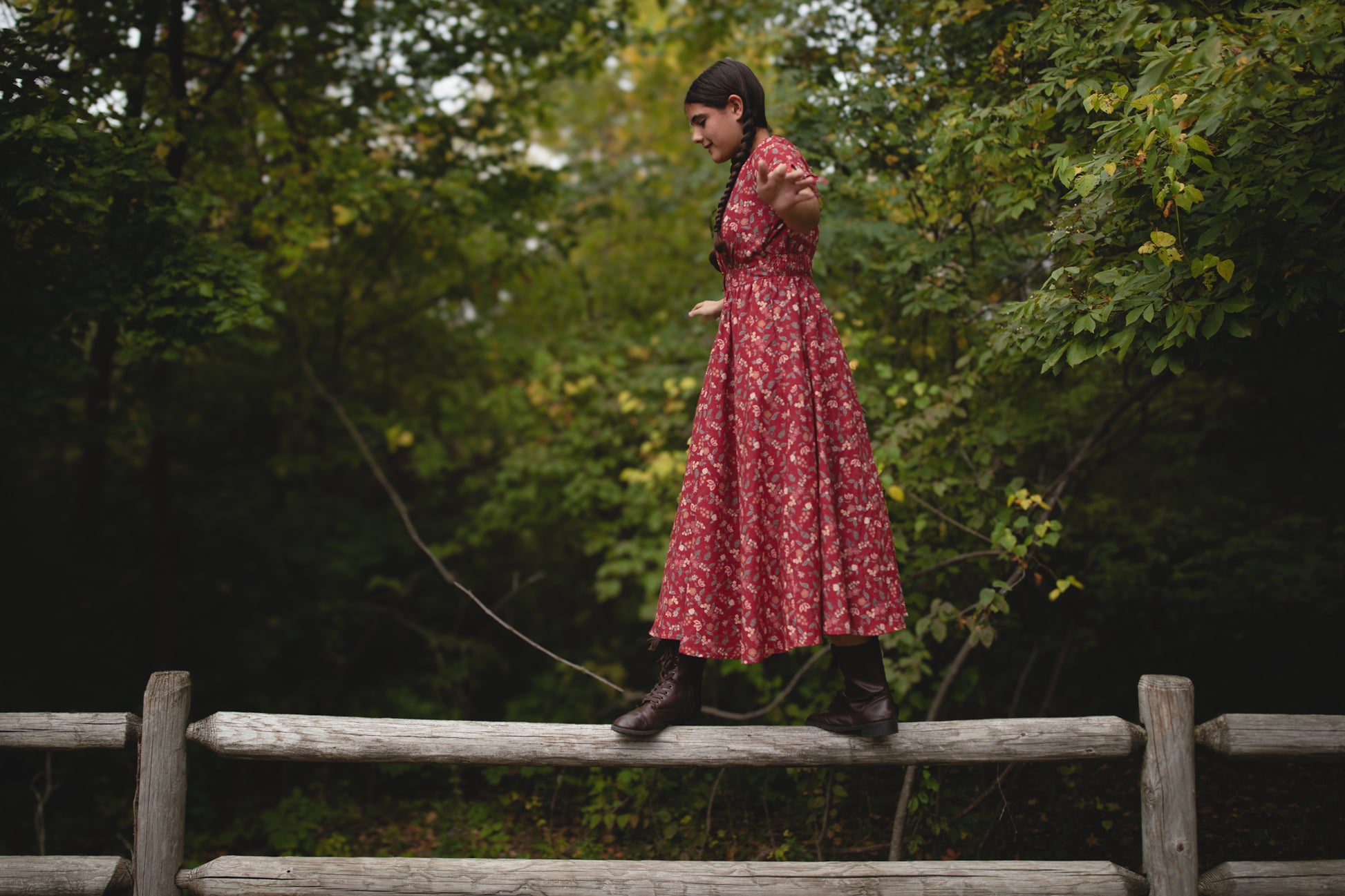 Woman in modest nursing red floral dress outdoors