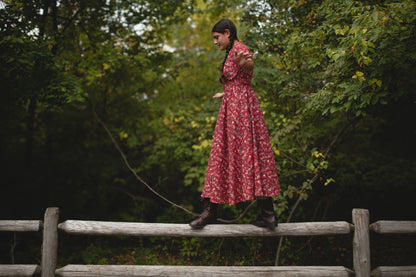 Woman in modest nursing red floral dress outdoors