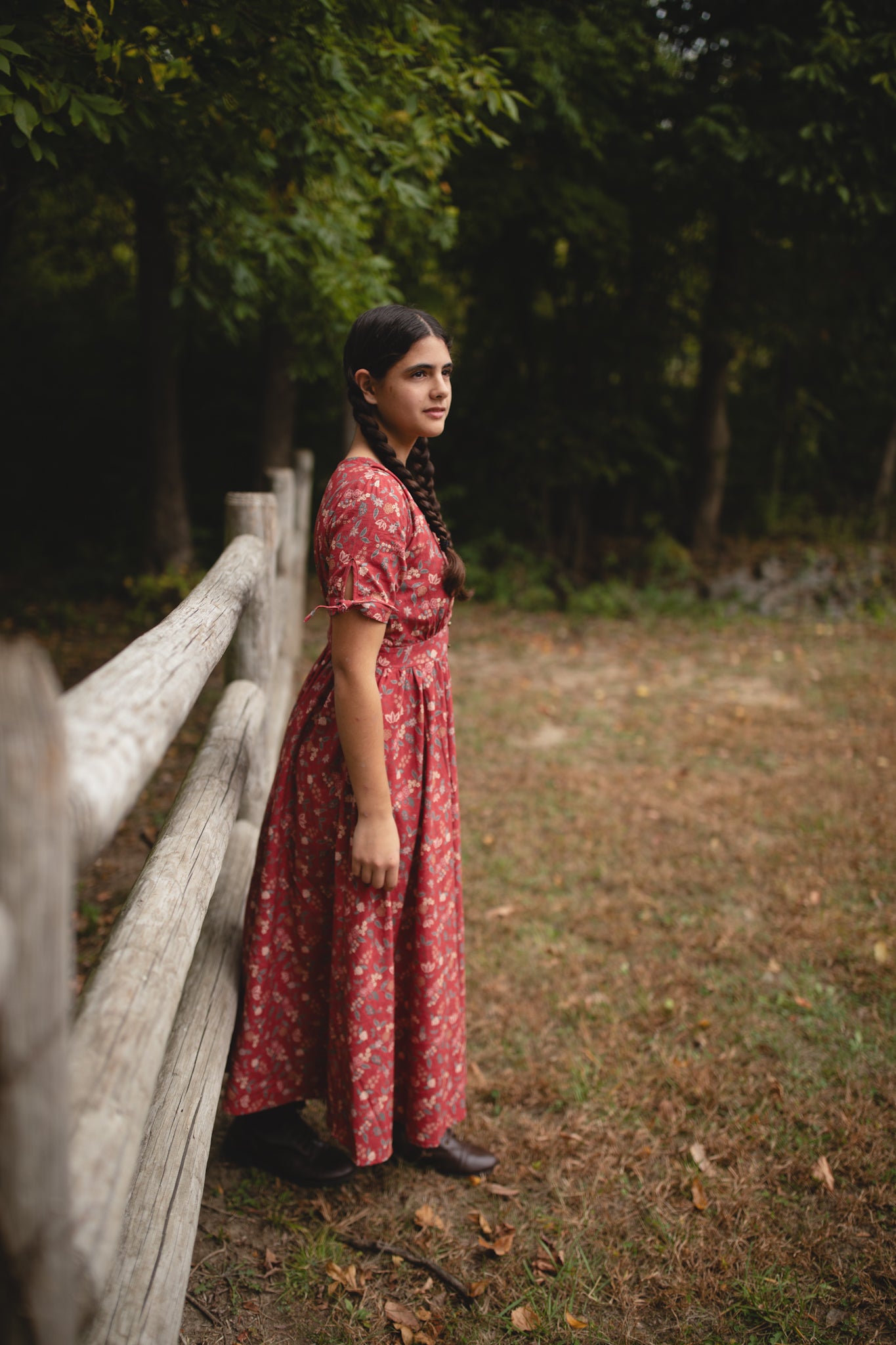 Woman in modest nursing red floral dress outdoors