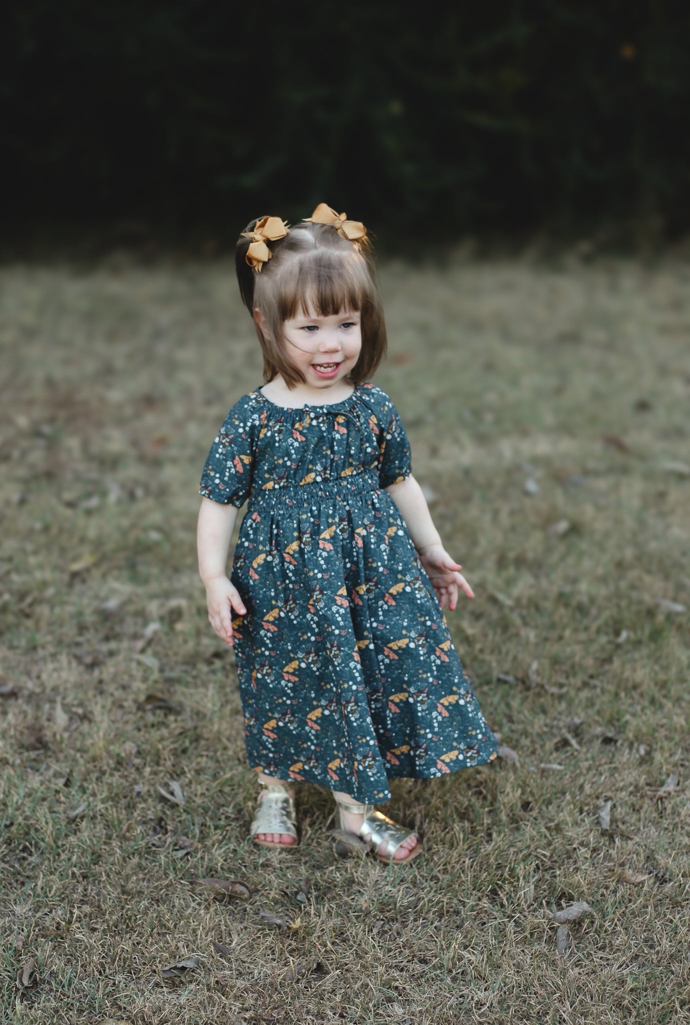 Girl in modest floral dress outdoors