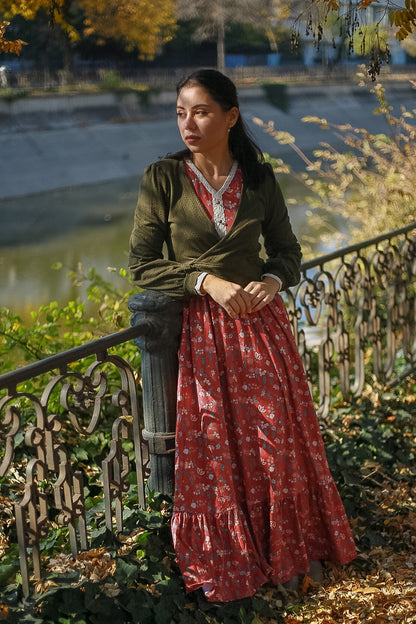 Woman in modest nursing red floral skirt outdoors