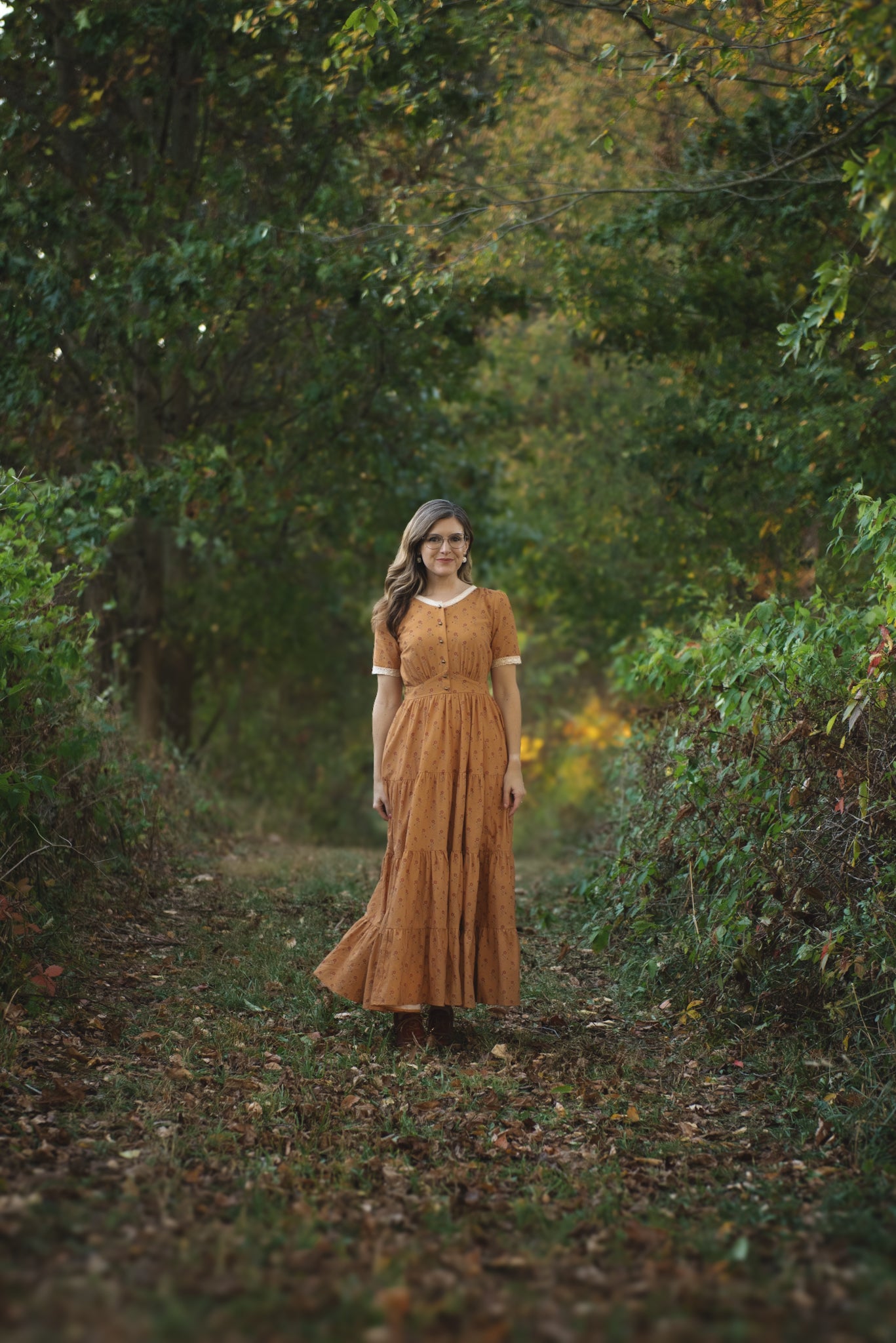 Woman in modest nursing dress in forest