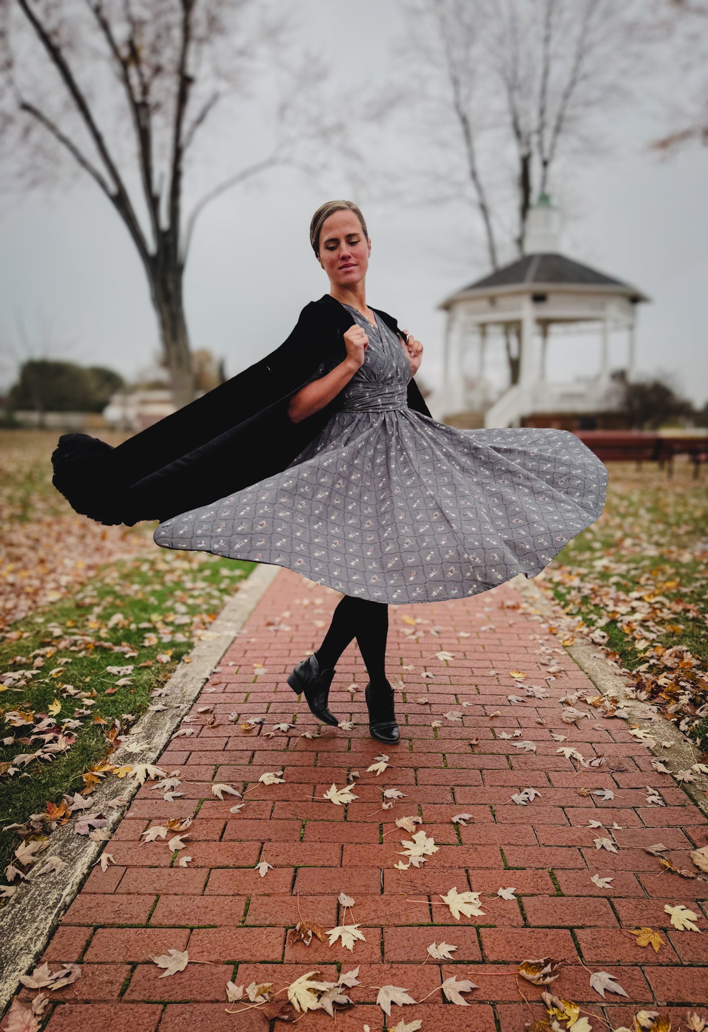 Modest nursing-friendly gray floral dress twirling