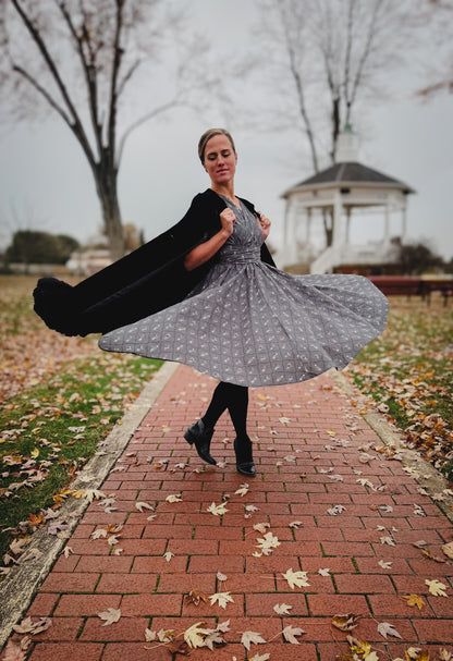 Modest nursing-friendly gray floral dress twirling