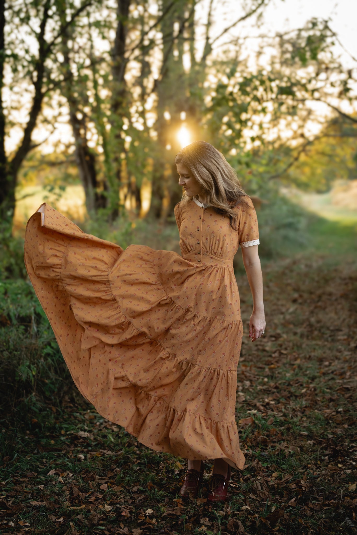 Woman in modest nursing dress walking forest