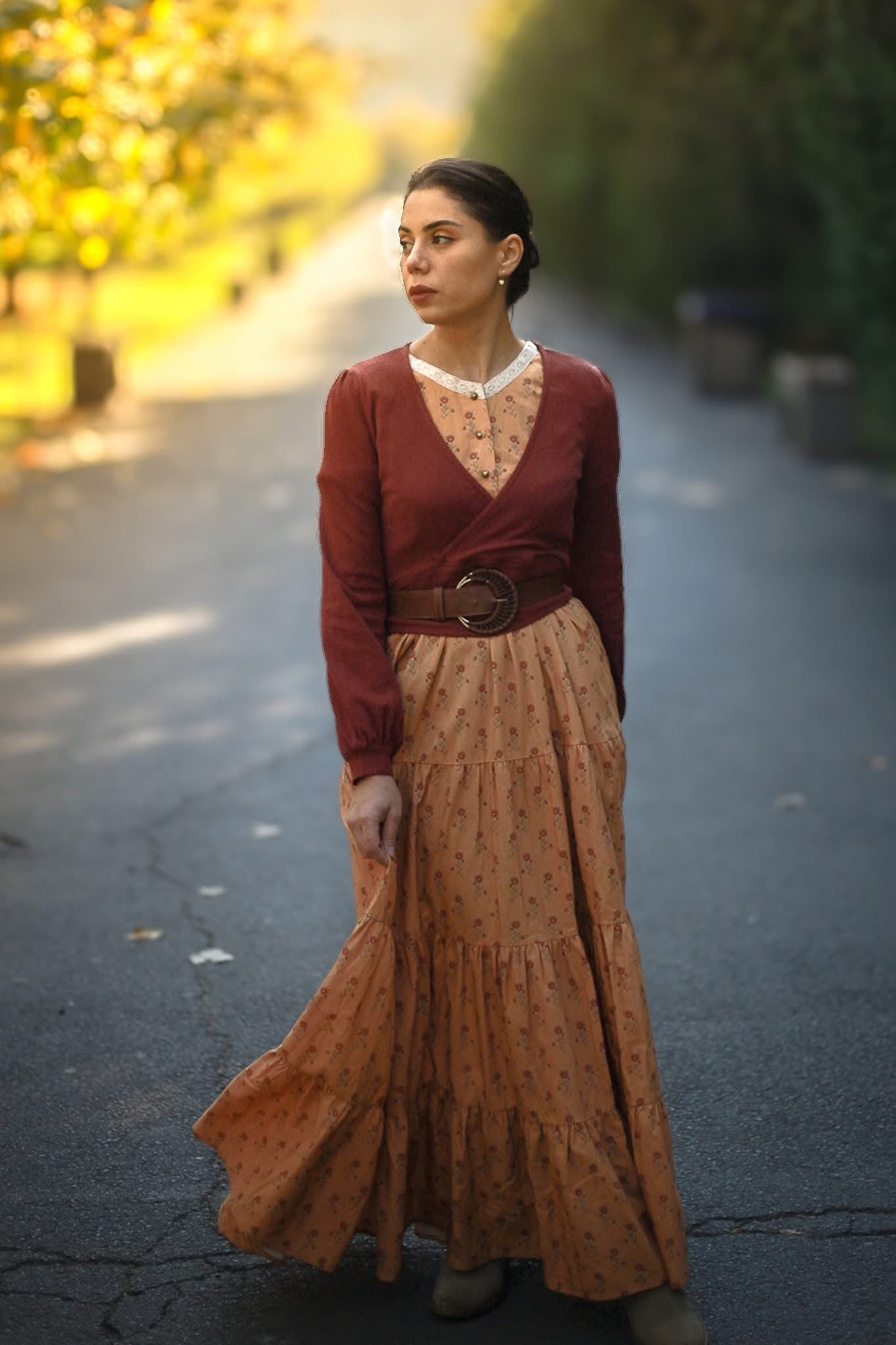 Woman in red top patterned skirt