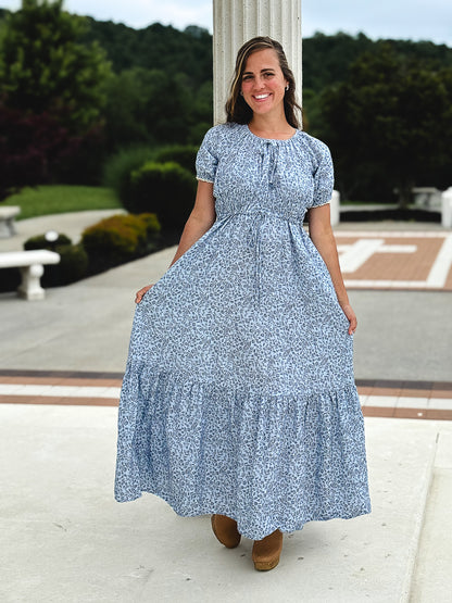 woman in a modest blue nursing dress
