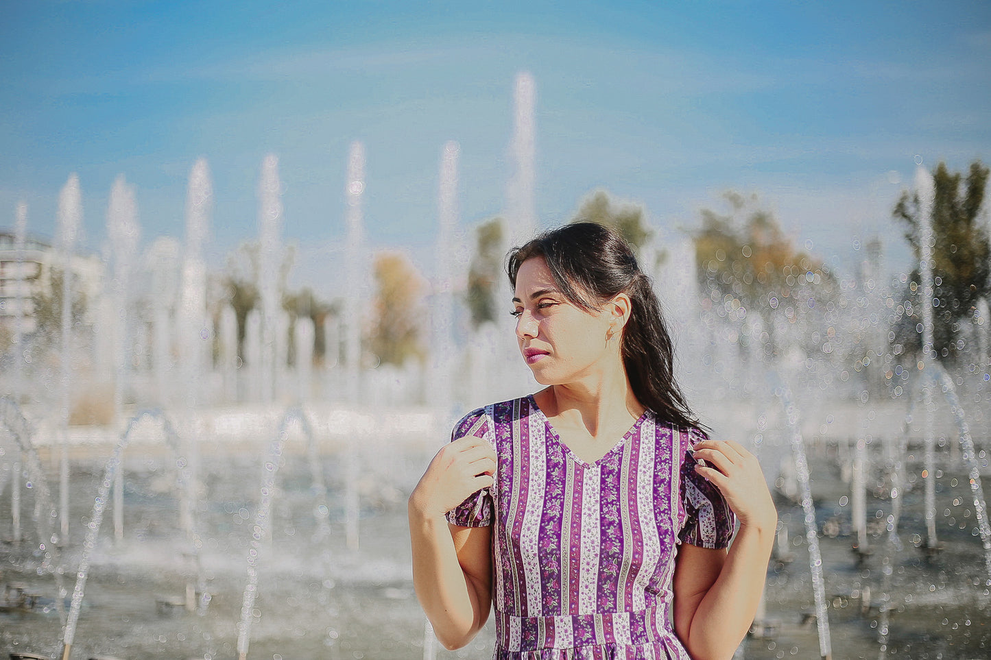 woman wearing a modest nursing purple and white striped dress