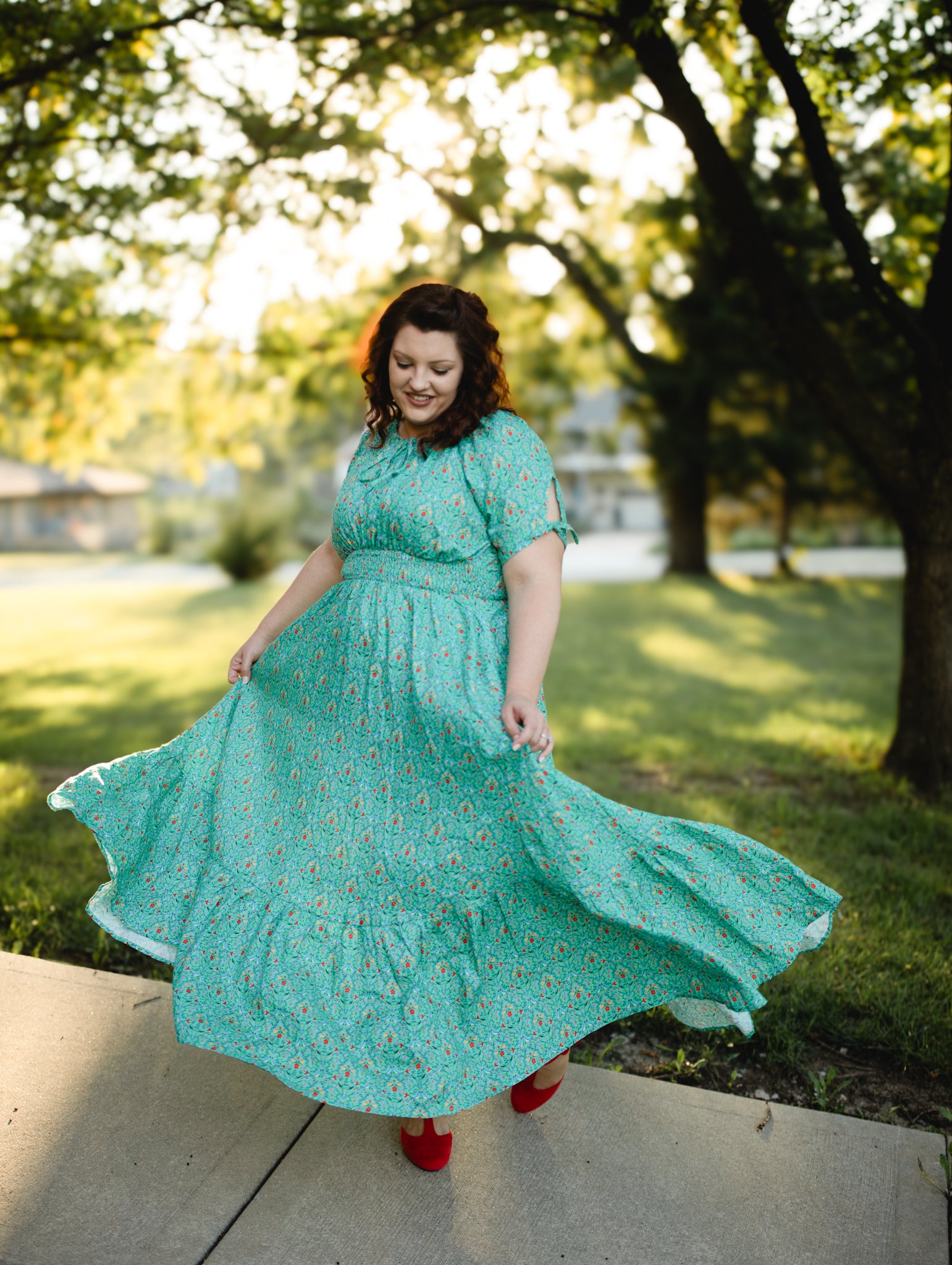 Woman in modest nursing teal floral dress