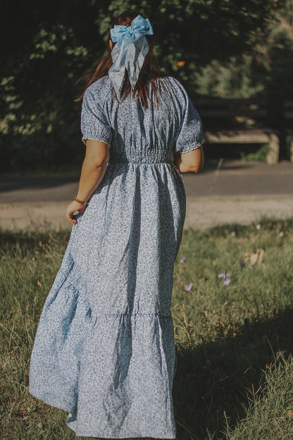 woman in a modest blue nursing dress