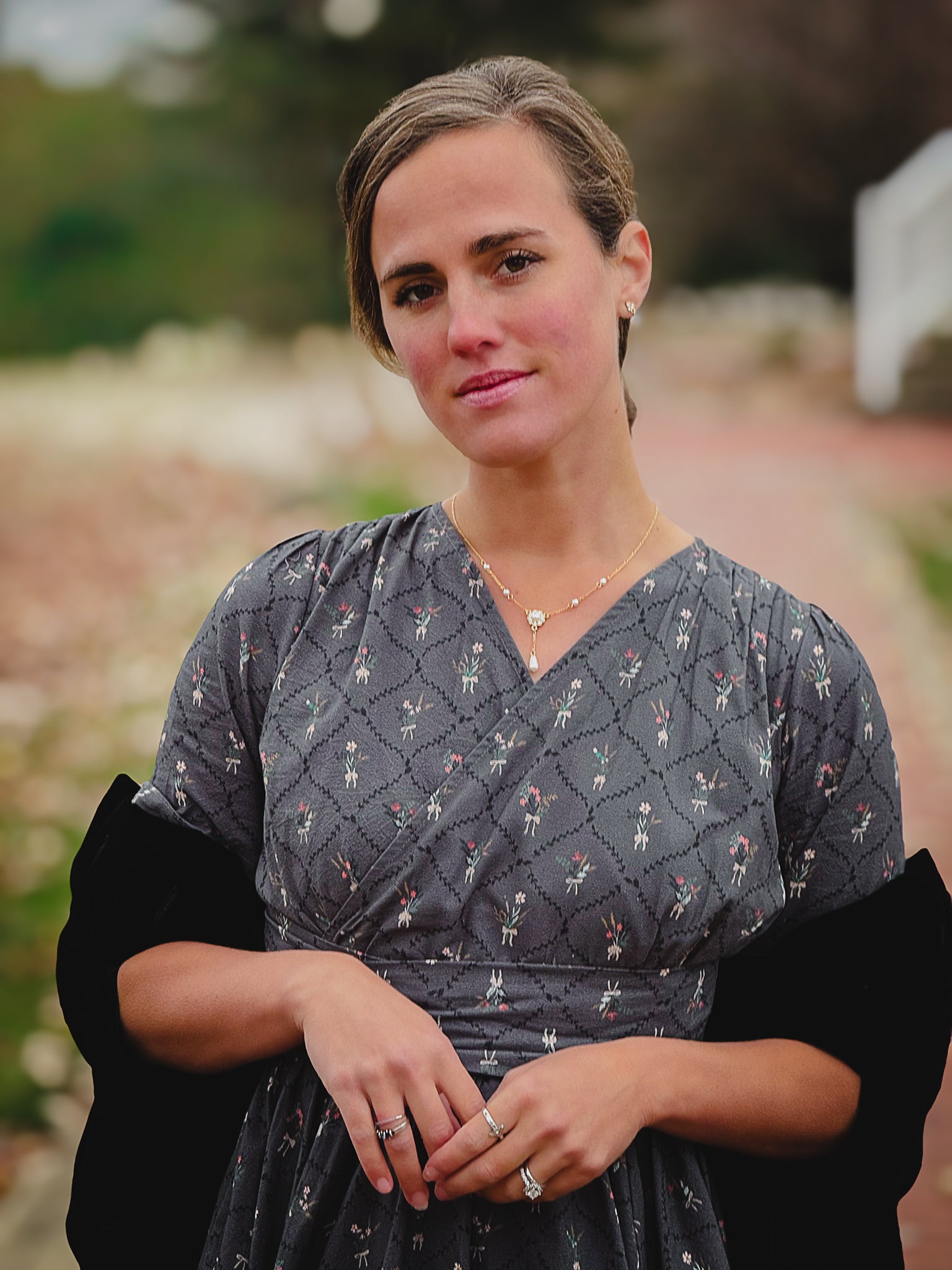 Modest nursing-friendly dark patterned dress portrait