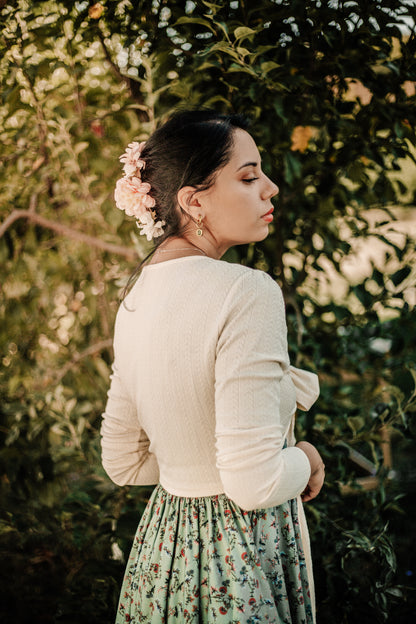 Woman in modest nursing outfit in natural setting