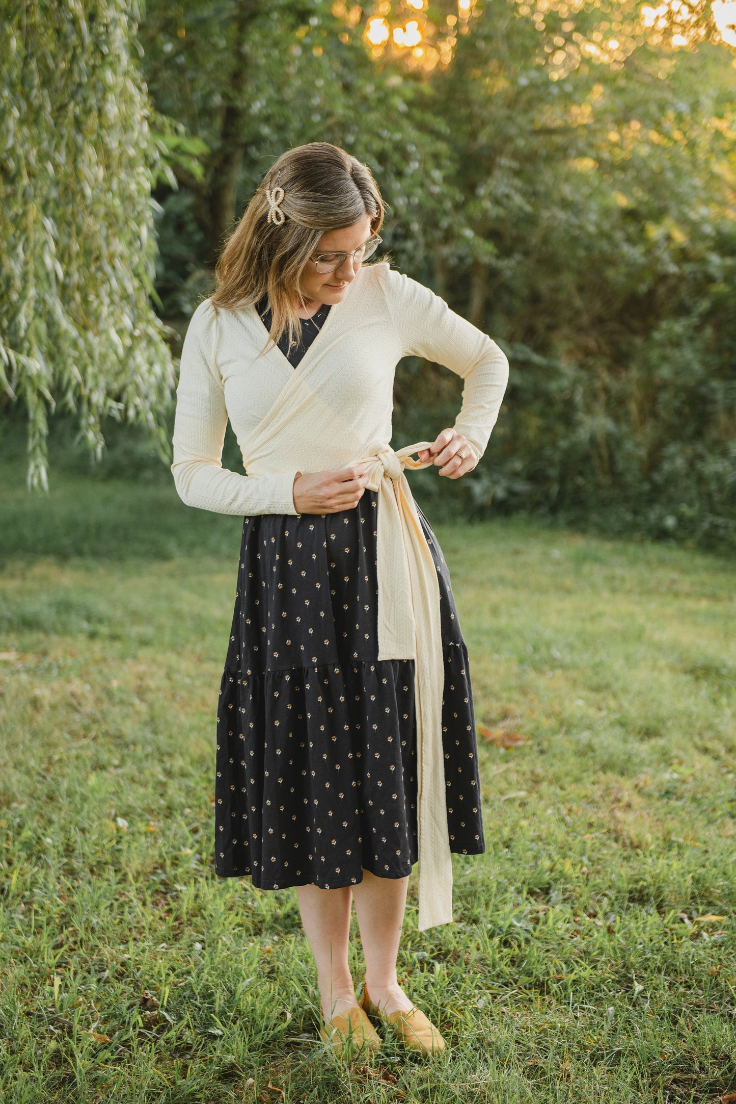 Woman in modest nursing patterned dress outdoors