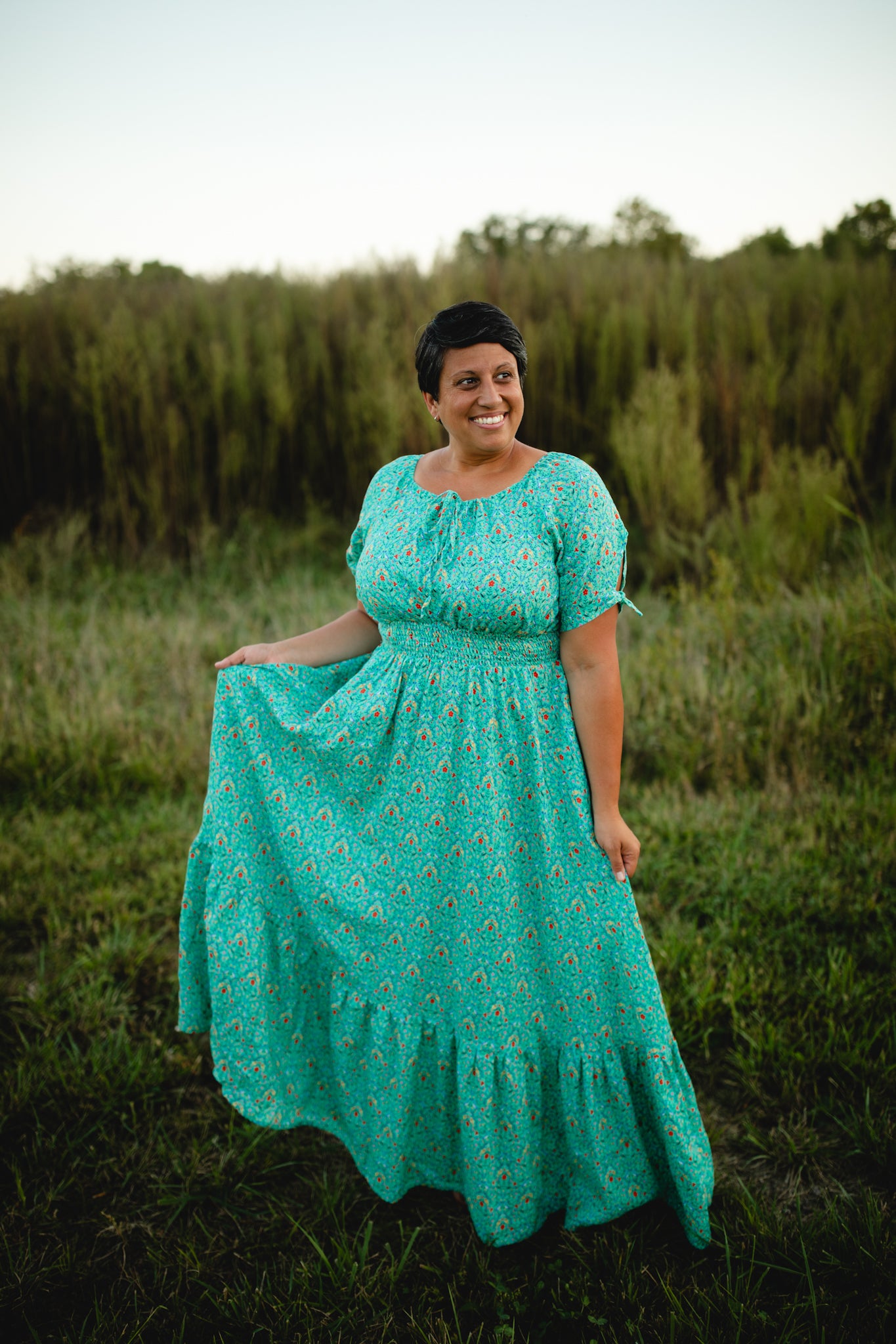 Woman in modest nursing dress in field