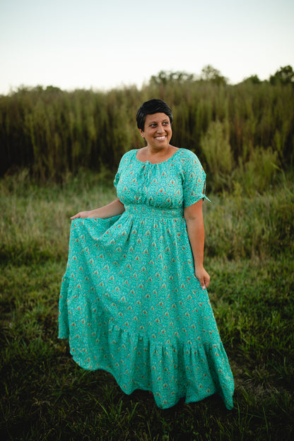 Woman in modest nursing dress in field