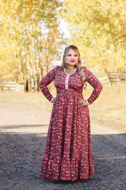 Woman in modest nursing red floral dress outdoors