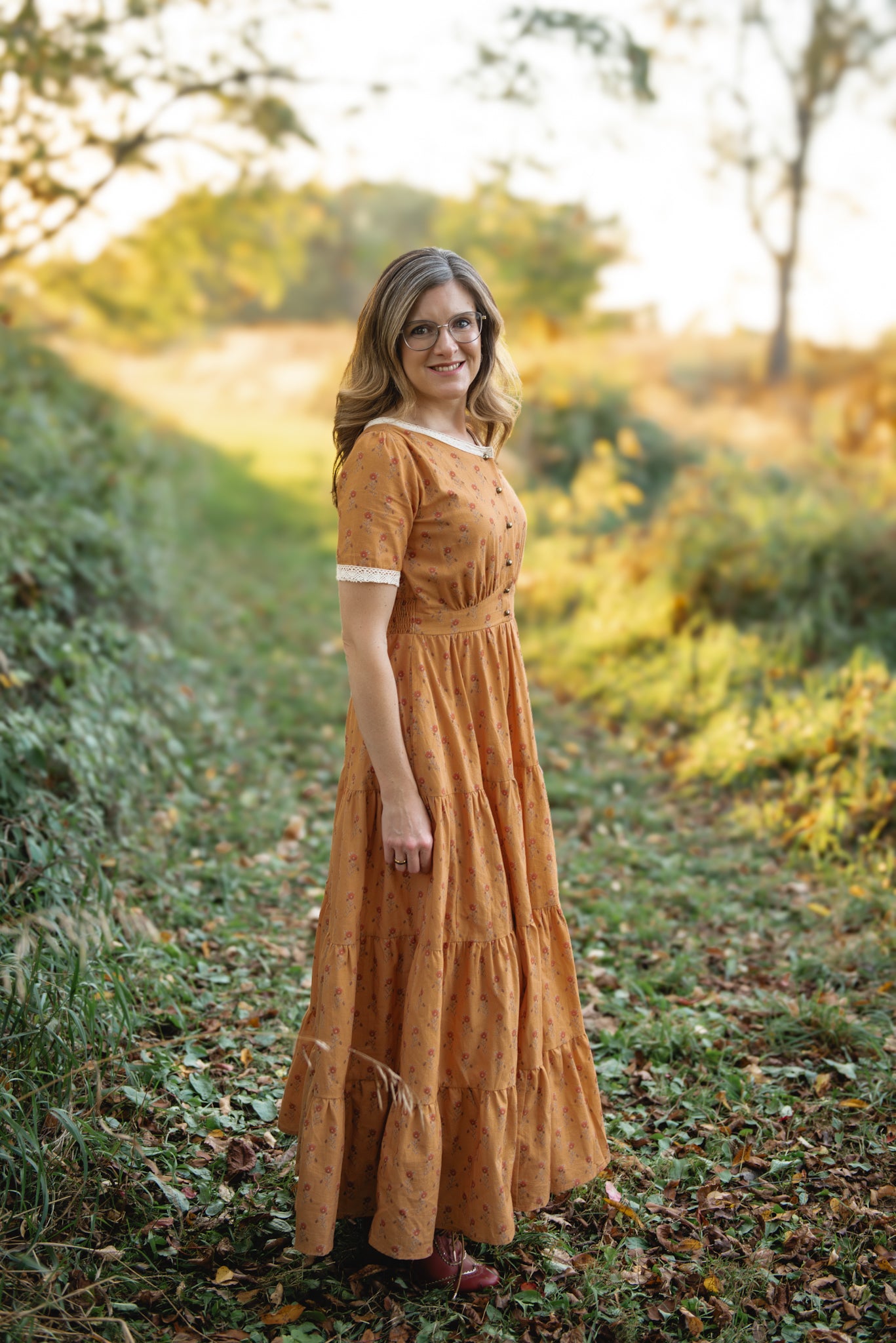 Woman in modest nursing dress yellow greenery