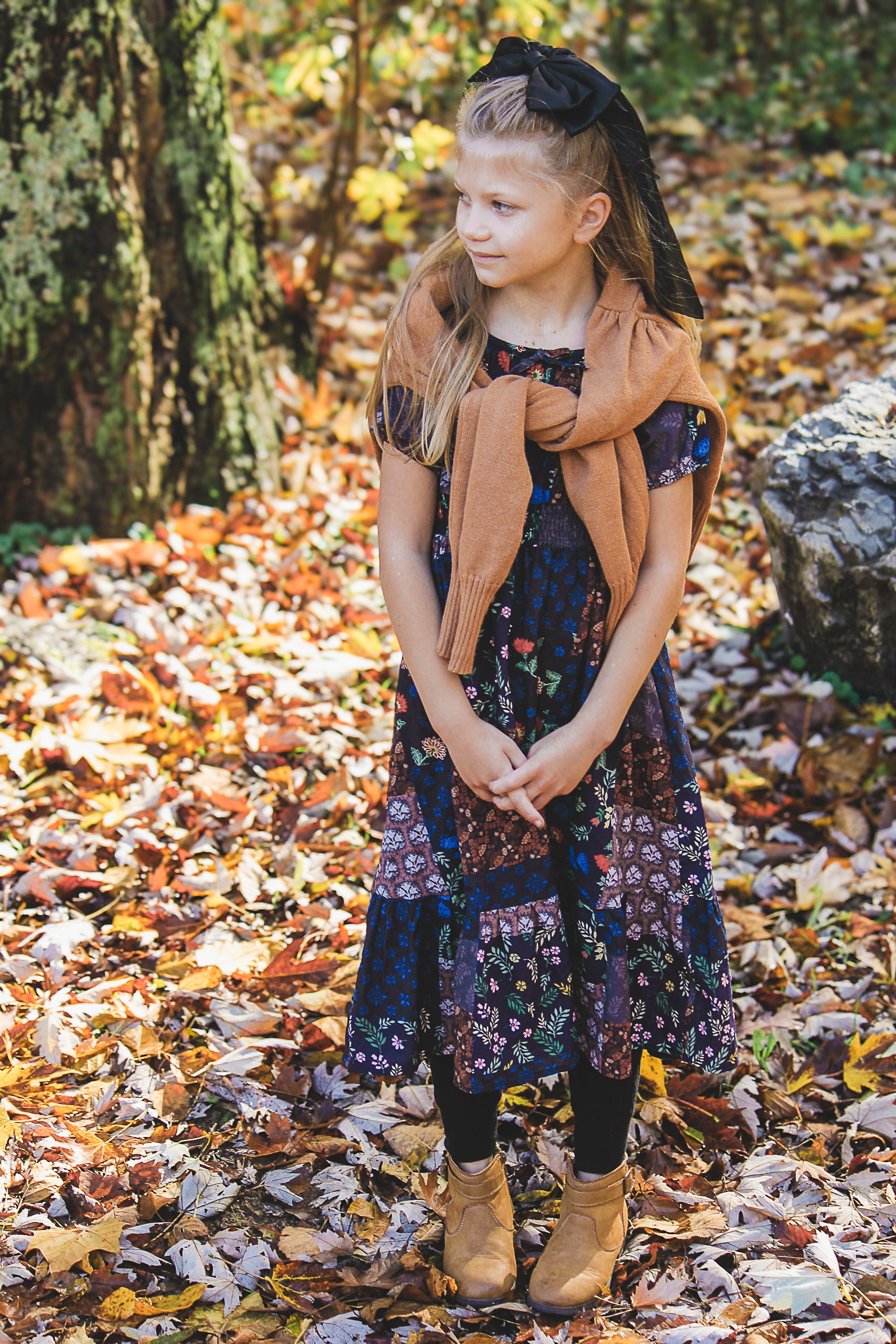 young girl wearing a cute patchwork dress