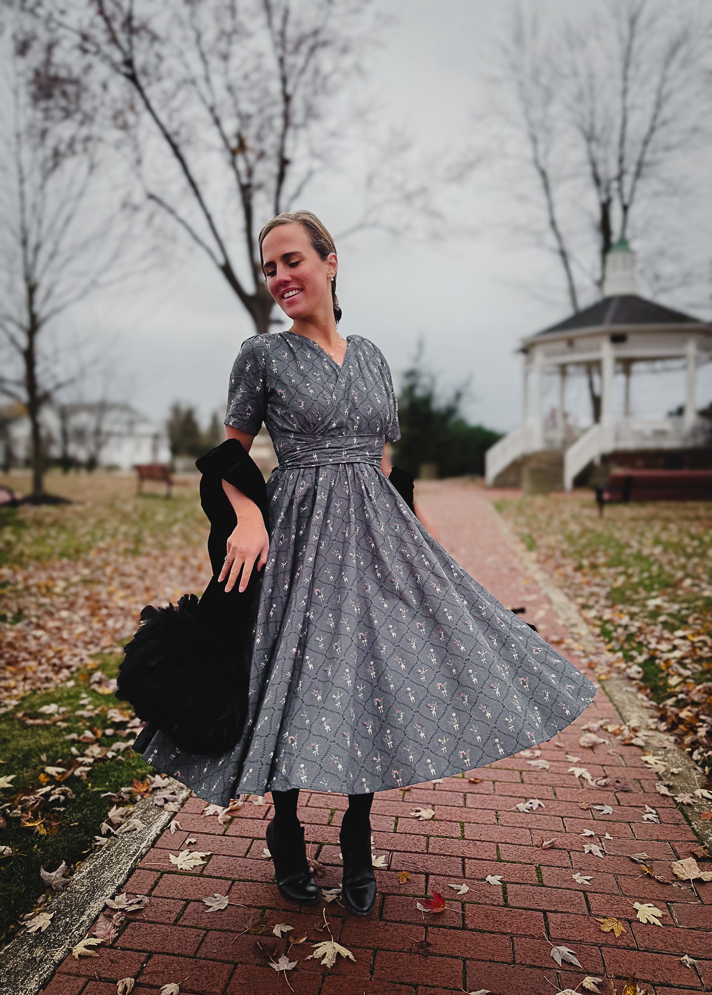 Modest nursing-friendly gray floral dress in park