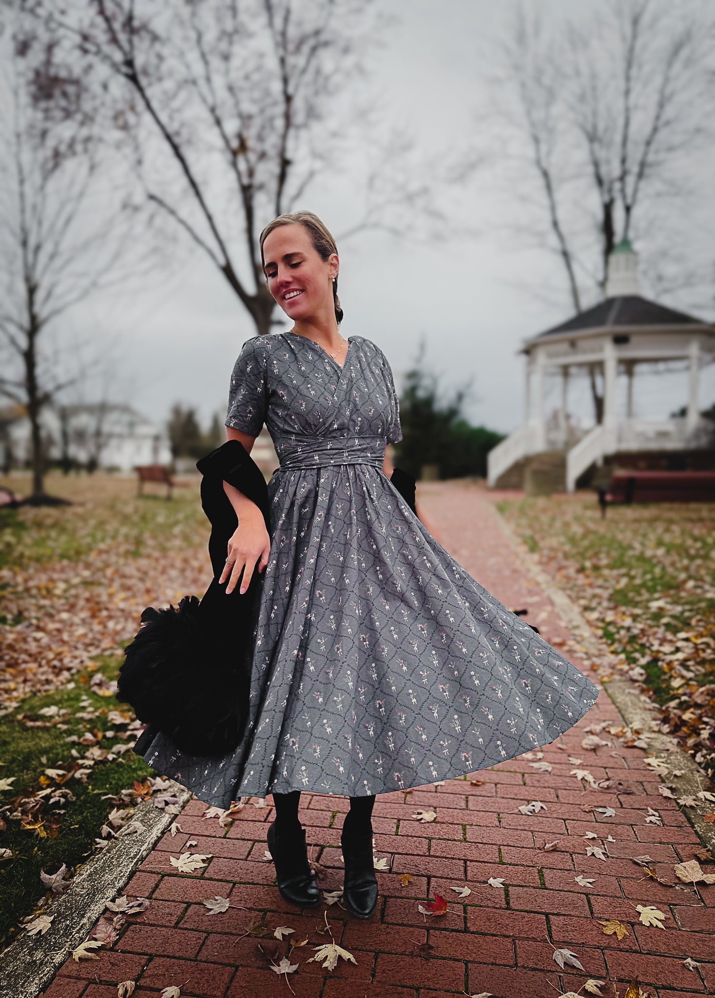 Modest nursing-friendly gray floral dress in park