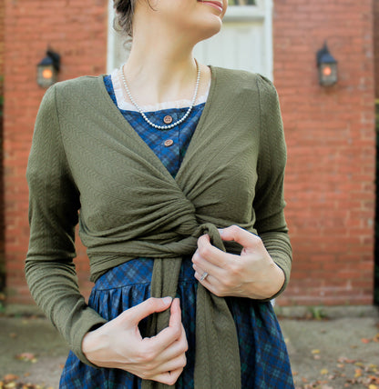 Woman in modest nursing wrap over dress