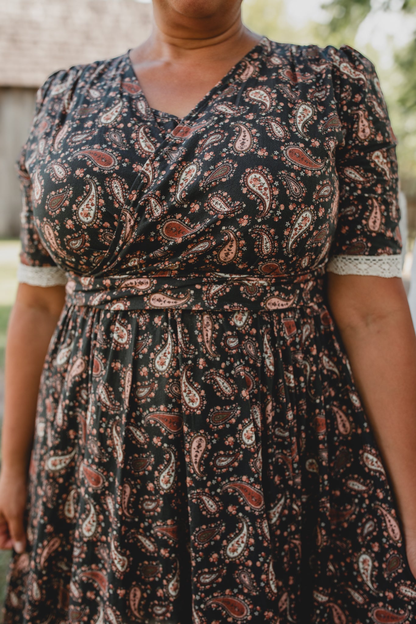 woman wearing a modest nursing black dress
