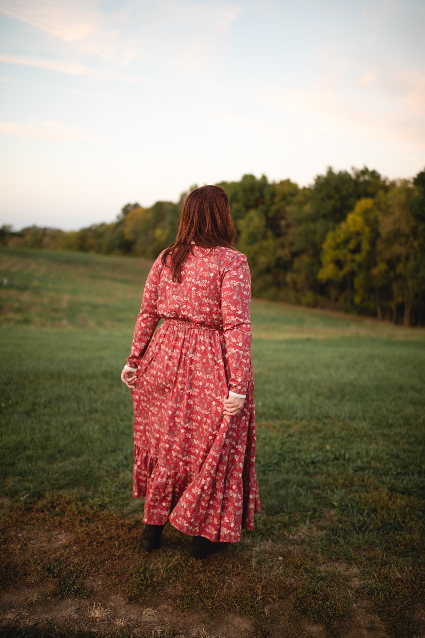 Woman in modest nursing red floral dress outdoors