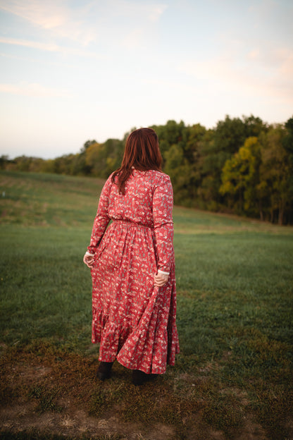 Woman in modest nursing red floral dress outdoors