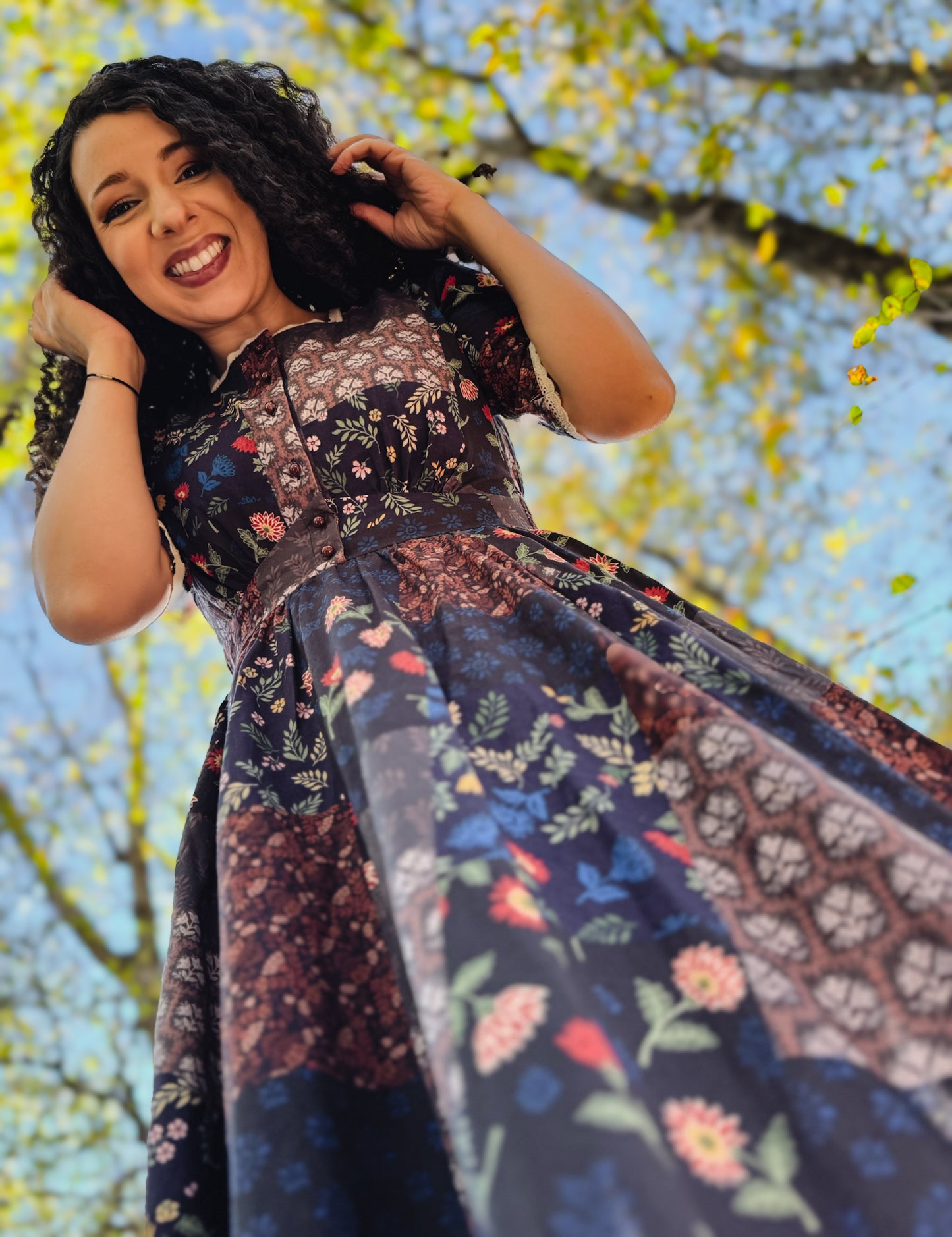 woman wearing a modest nursing patterned dress