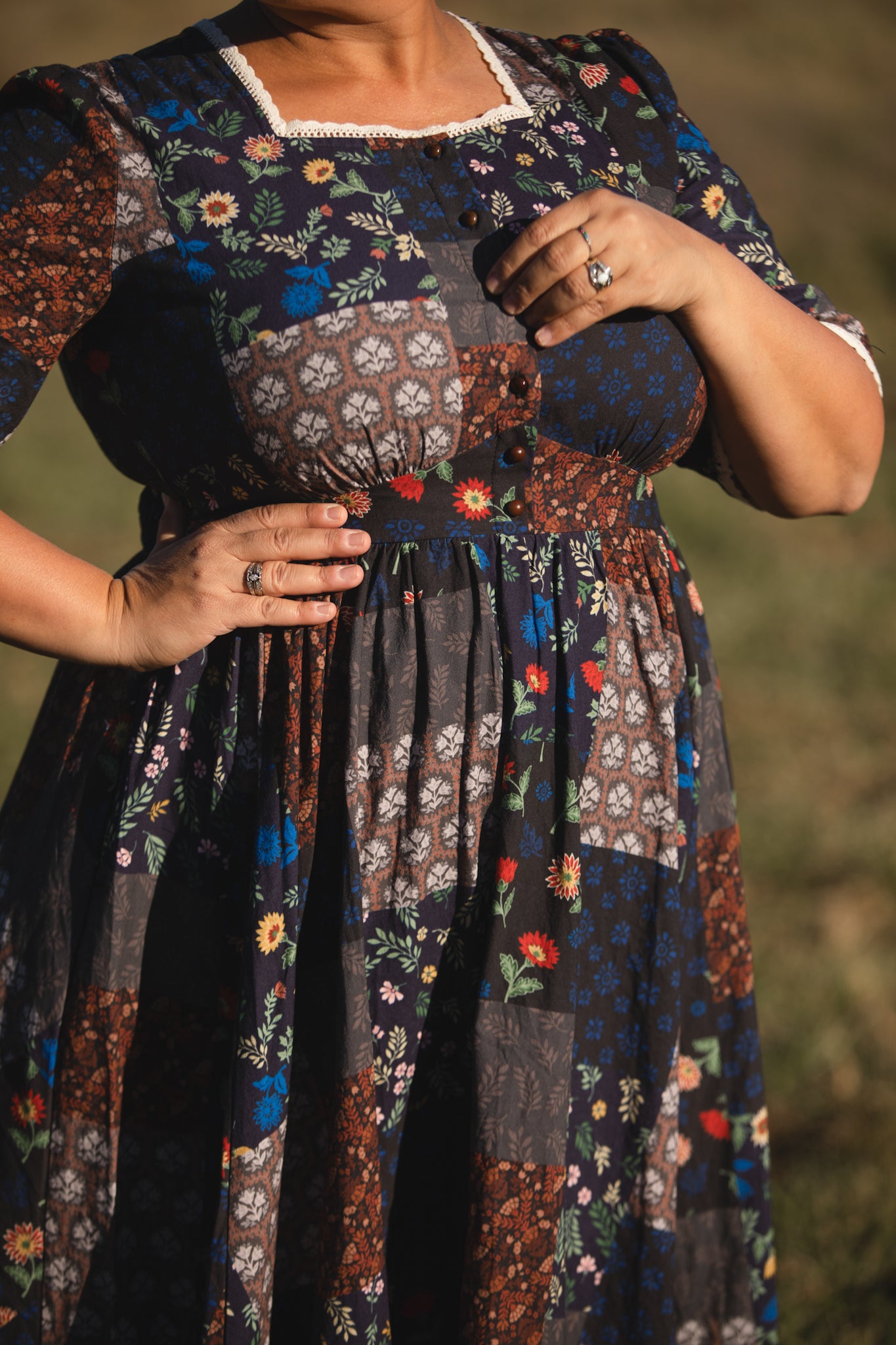 woman wearing a modest nursing patterned dress