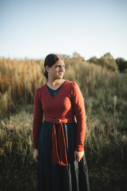 Woman in modest nursing wrap and dark skirt