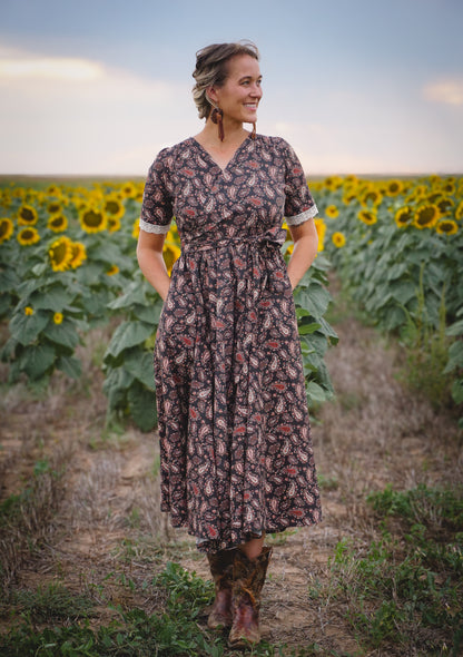 woman wearing a modest nursing black dress