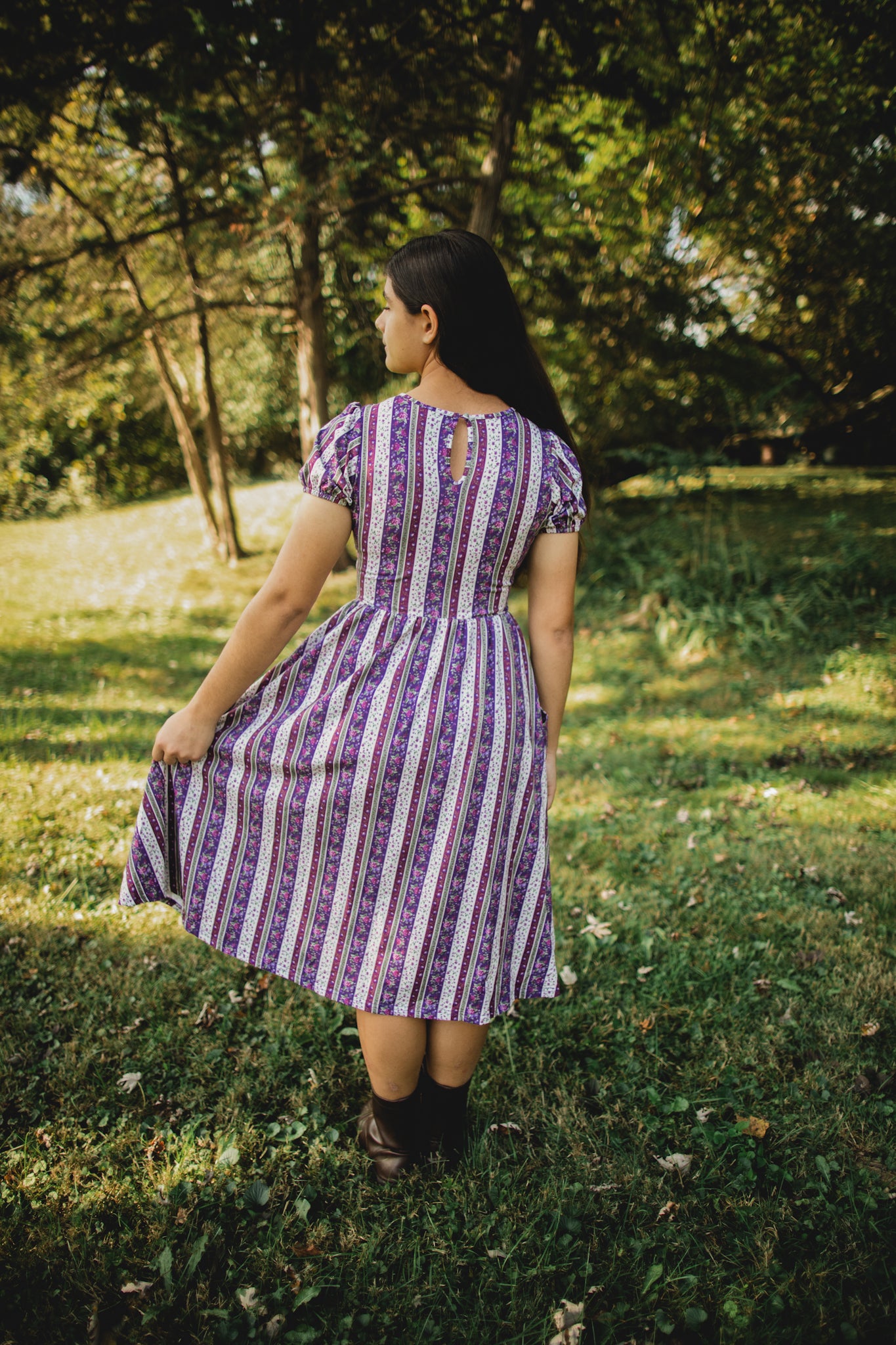 woman wearing a modest nursing purple and white striped dress