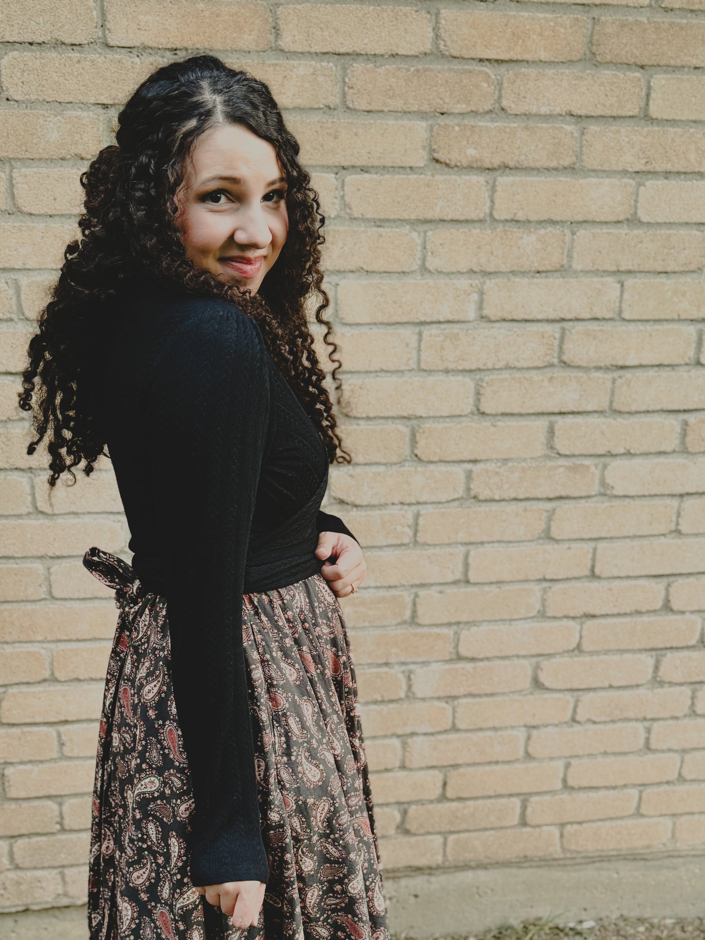woman wearing a modest nursing black dress