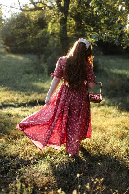 Woman in modest nursing red dress outdoors