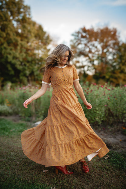 Woman in modest nursing dress natural setting