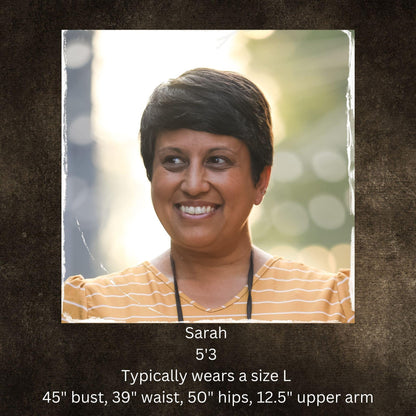 Woman smiling in striped shirt with model stats text