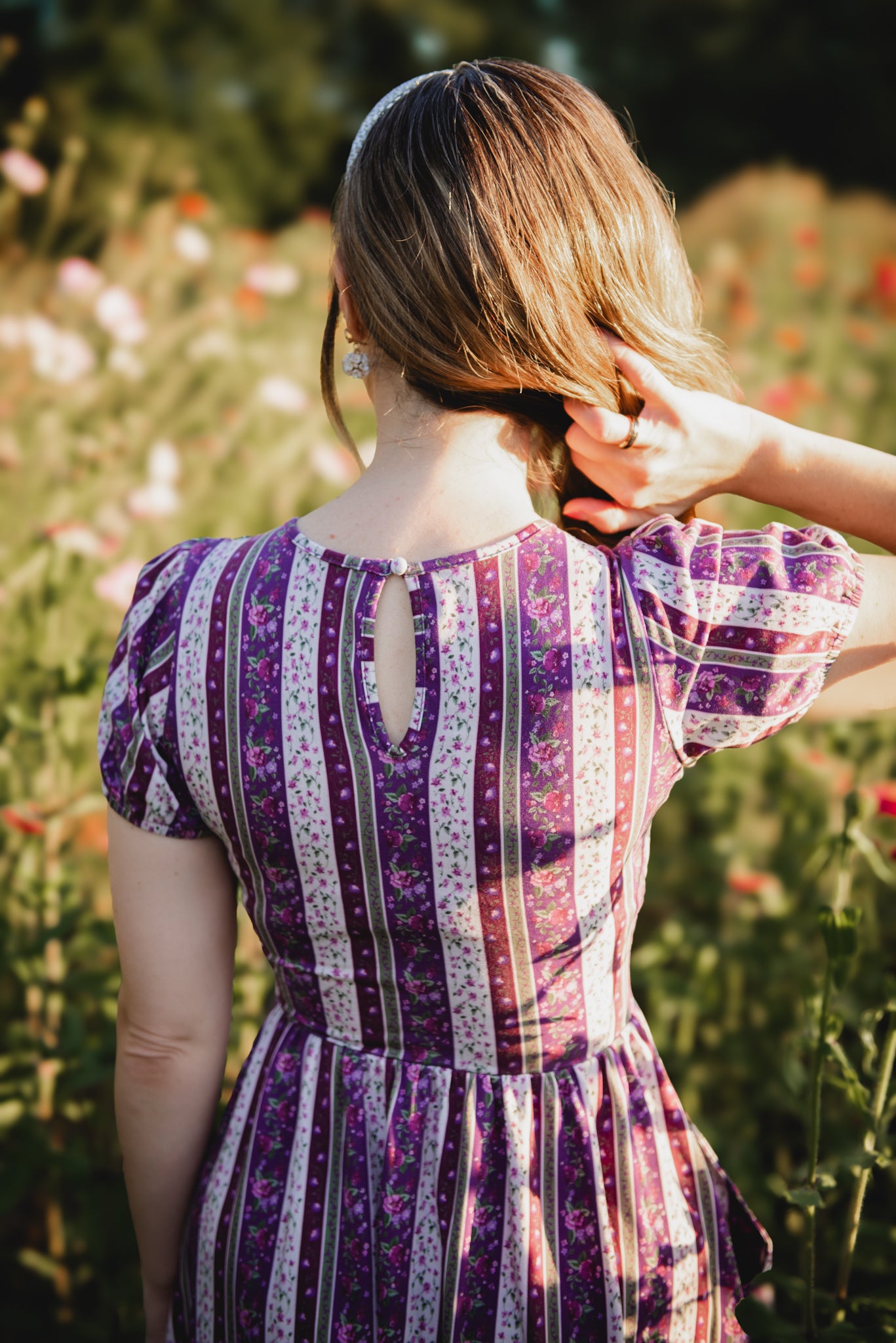 woman wearing a modest nursing purple and white striped dress