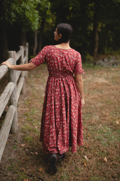 Woman in modest nursing red floral dress outdoors