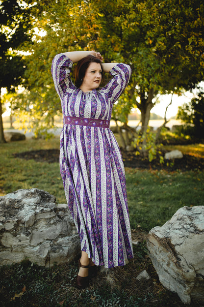 Woman in modest nursing striped dress outdoors