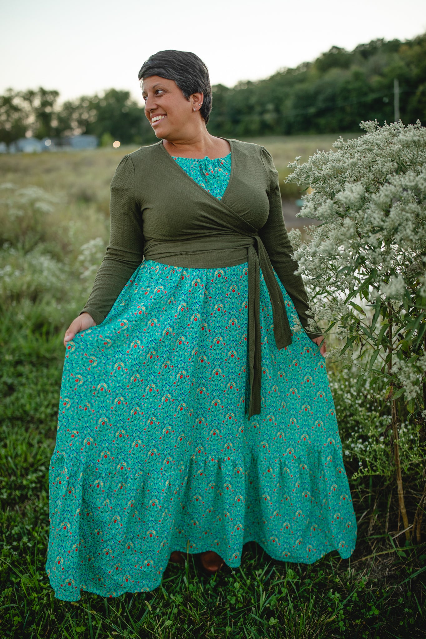Woman in modest nursing green wrap dress