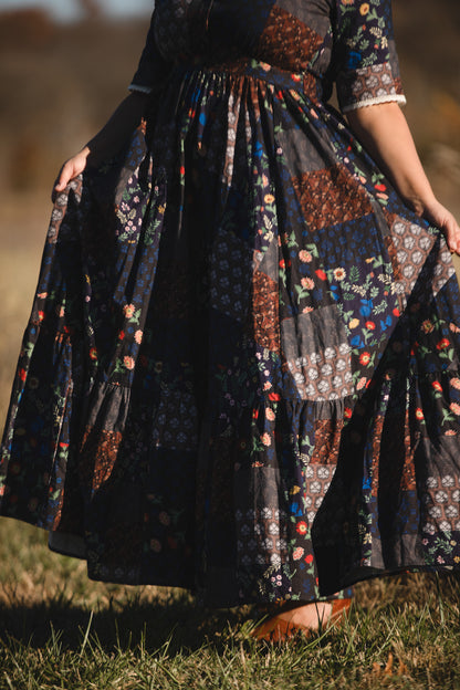 woman wearing a modest nursing patterned dress