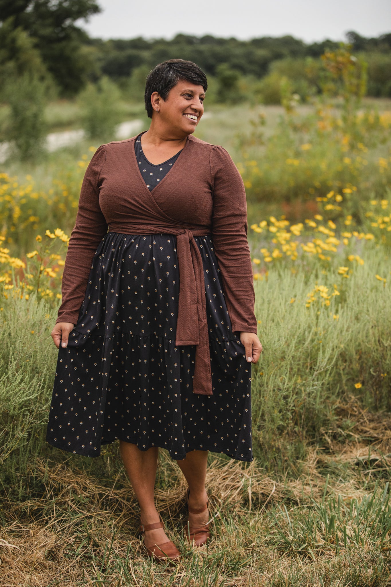Woman in modest nursing dress in flower field