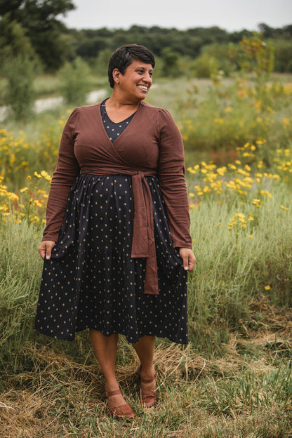 Woman in modest nursing dress in flower field