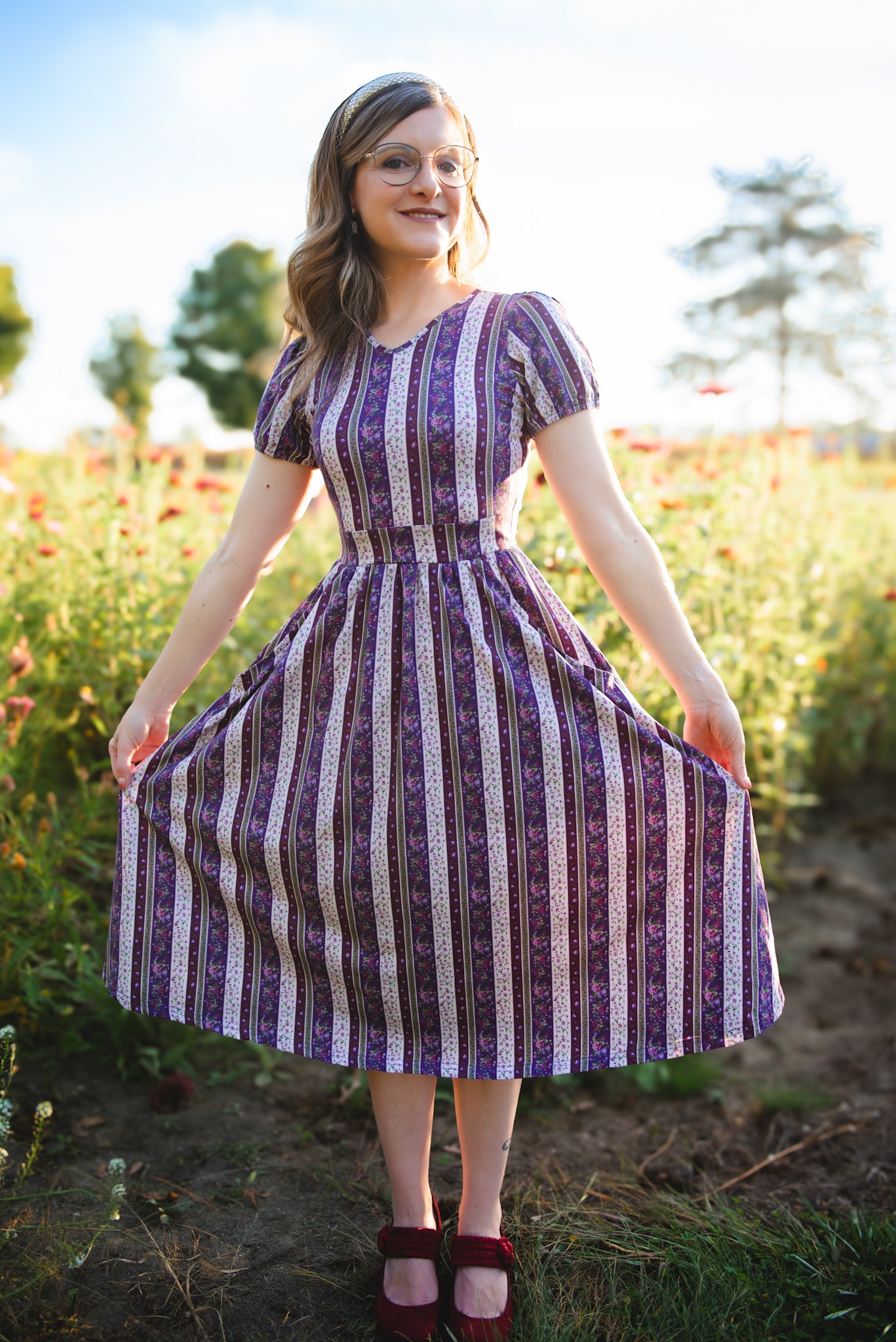 woman wearing a modest nursing purple and white striped dress
