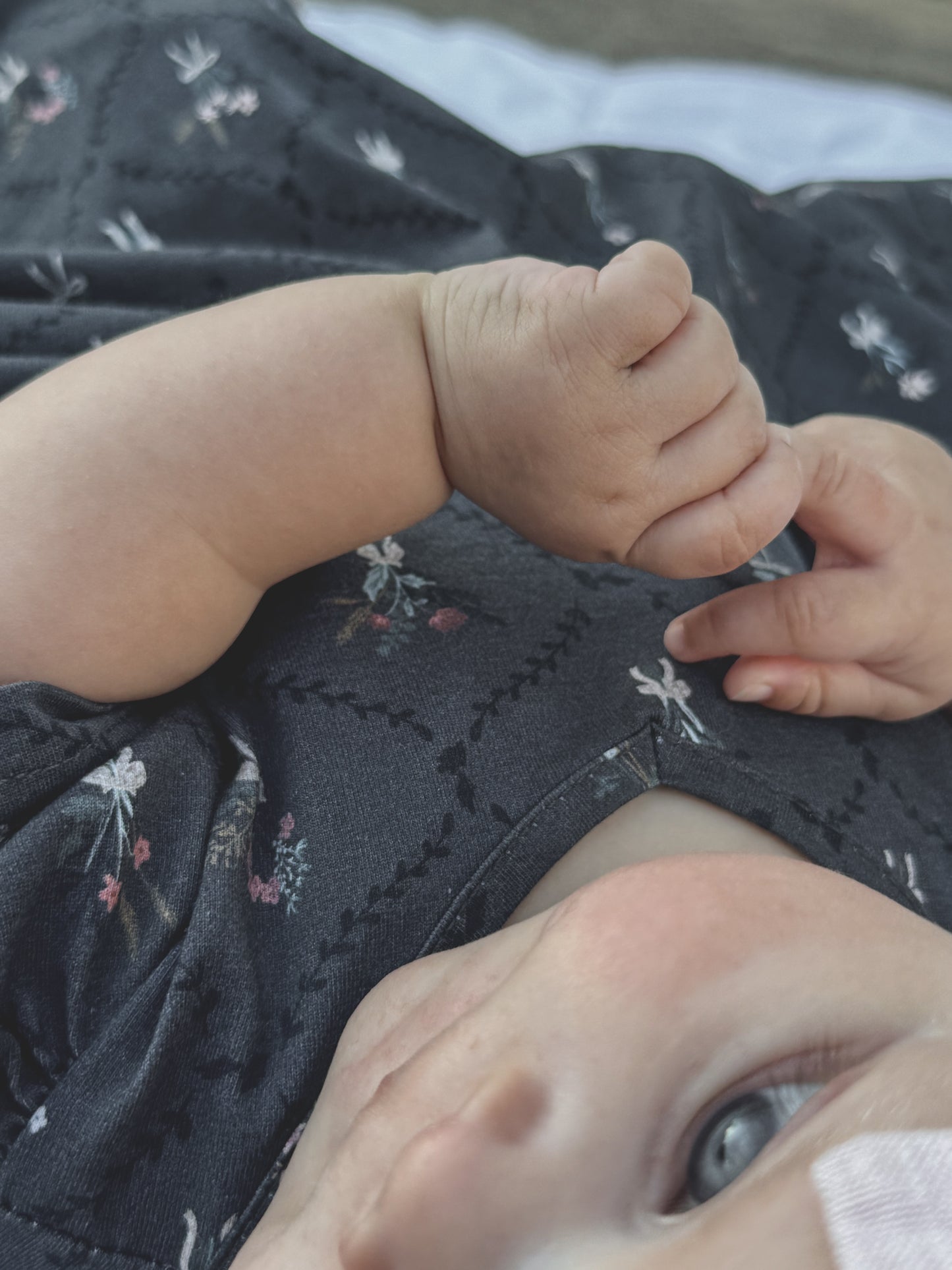 Modest baby hand face dark floral dress