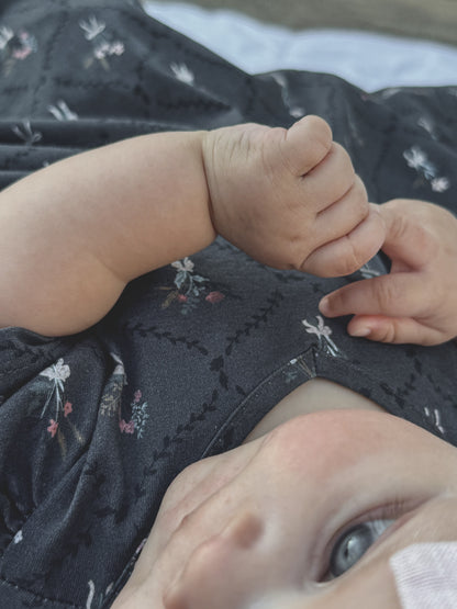 Modest baby hand face dark floral dress