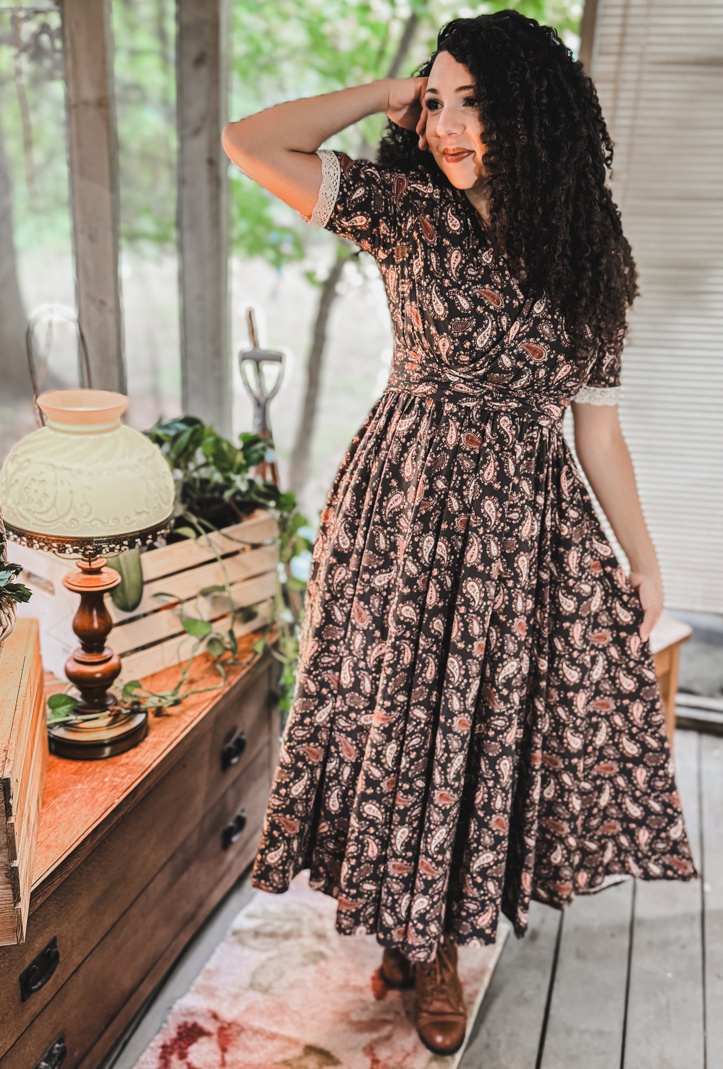Woman in modest nursing dress indoors with plants