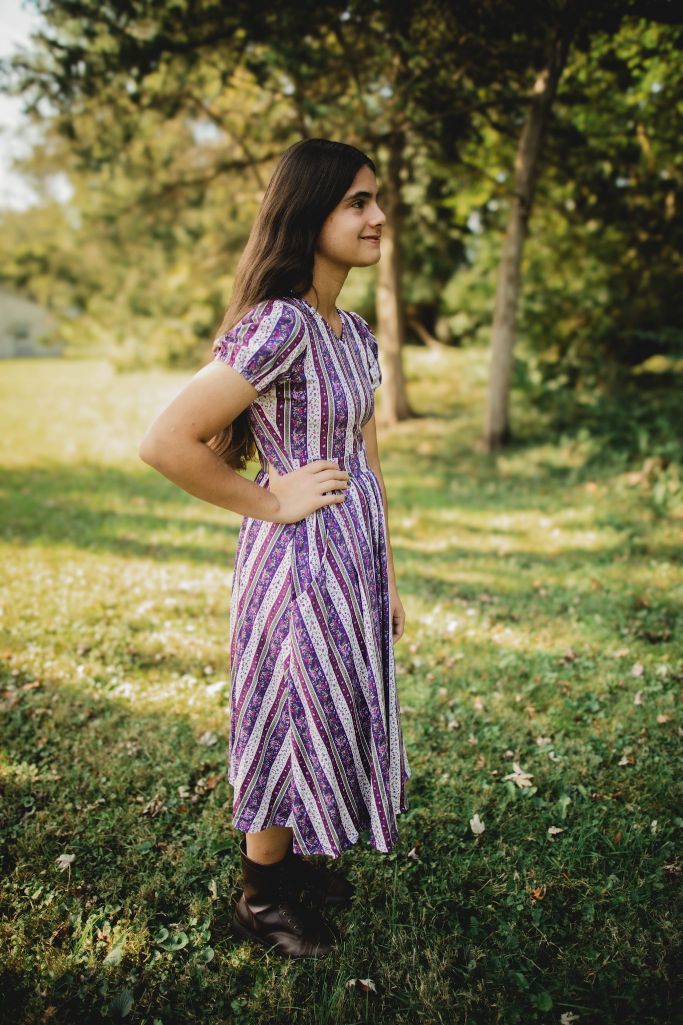 woman wearing a modest nursing purple and white striped dress