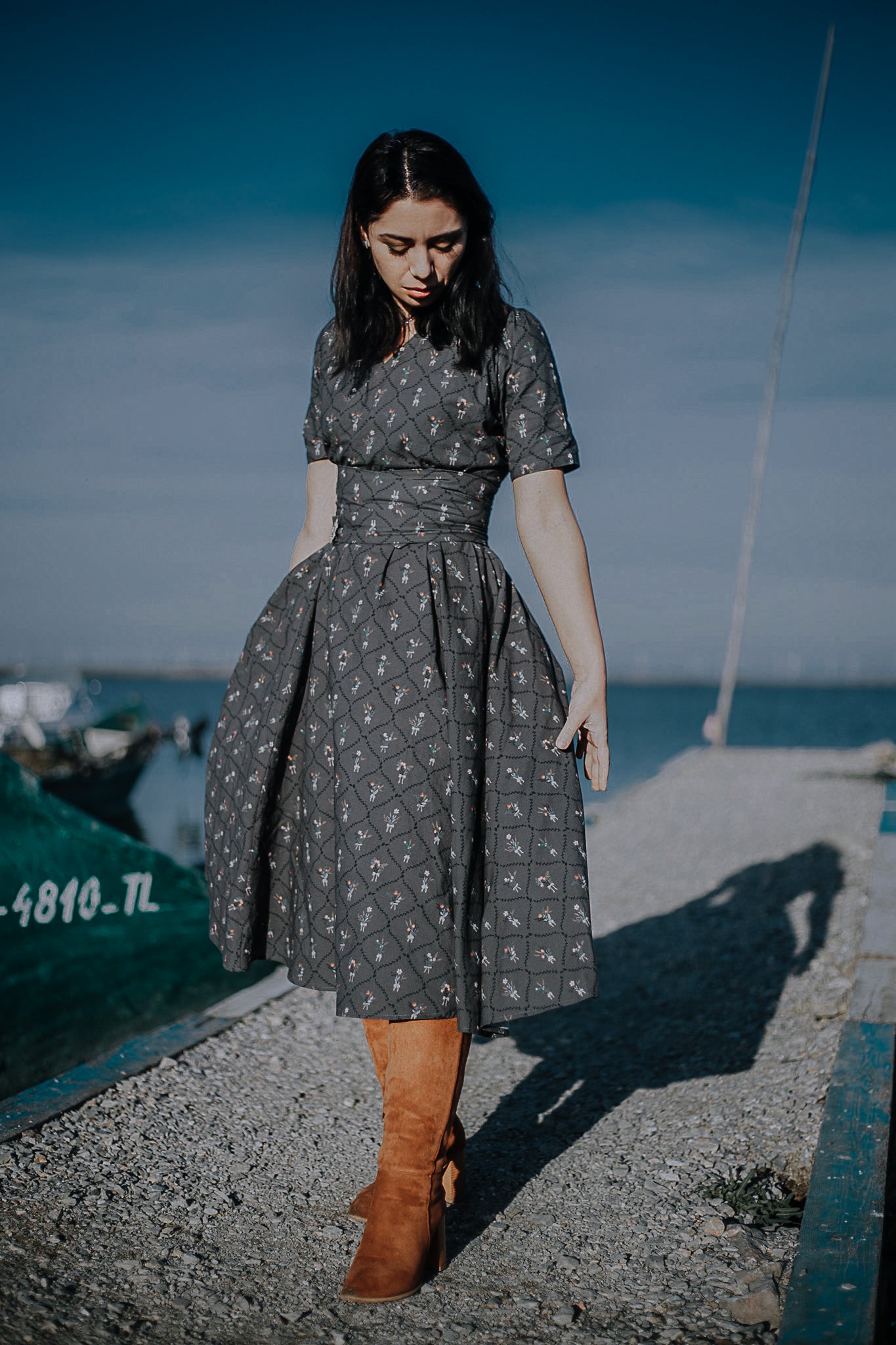 Modest nursing-friendly gray patterned dress on dock